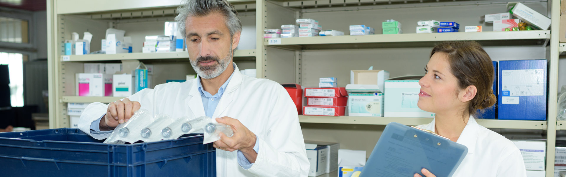 pharmacist packaging a medicine