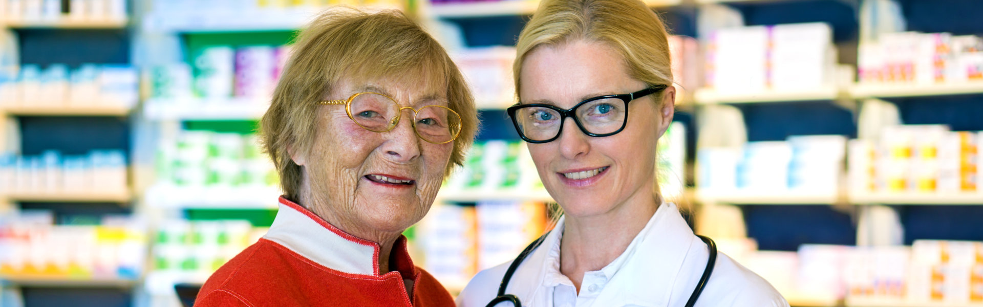 elderly and pharmacist smiling