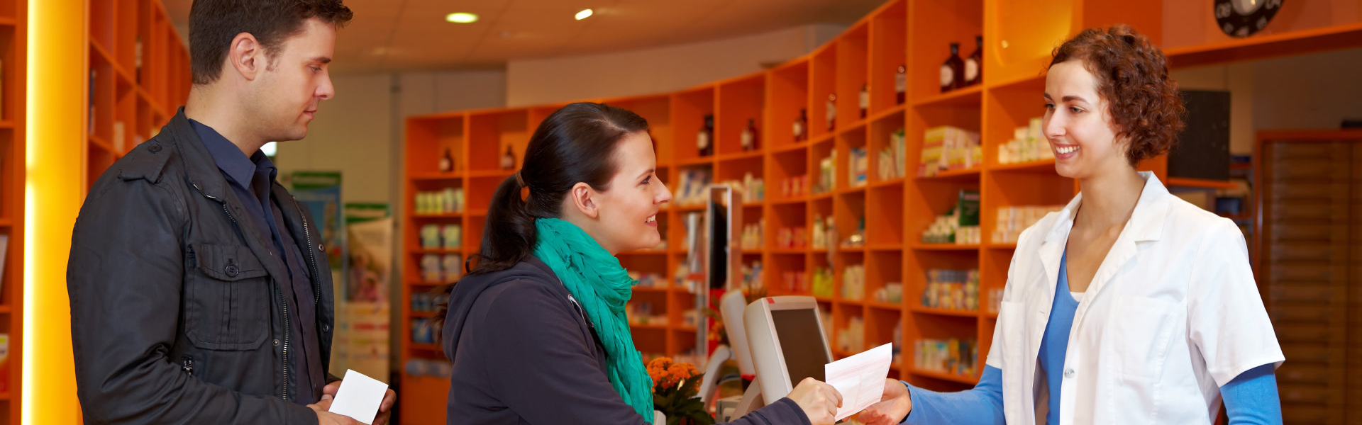 man and woman buying a medicine